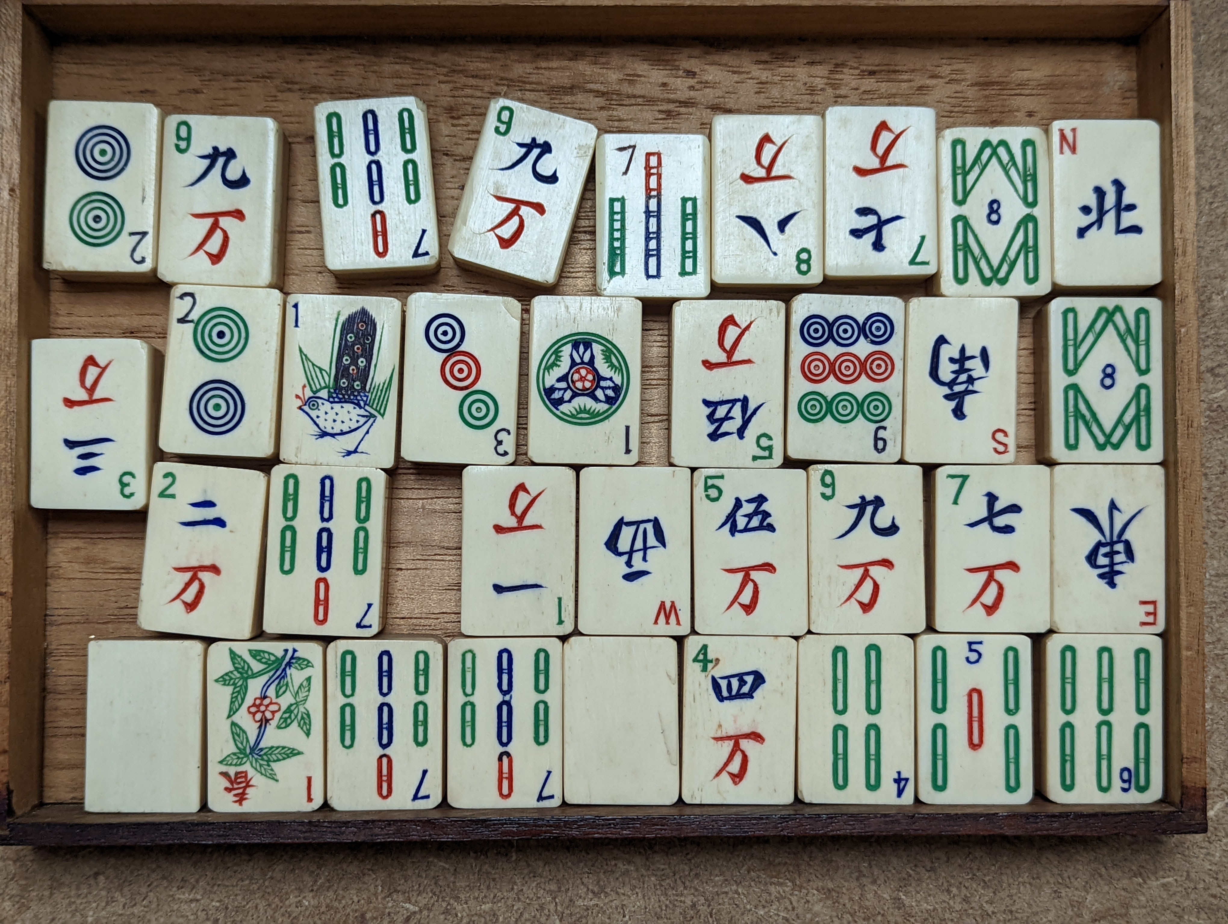 A Mah Jong set in wooden box, 17 cms high.